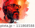 A man with a beard is wearing glasses and headphones on his head 111868588
