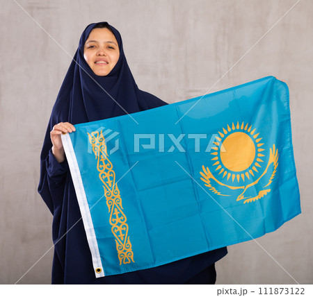 Young woman in hijab posing with flag of Kazakhstan Young woman in hijab posing with flag of Kazakhstan 111873122