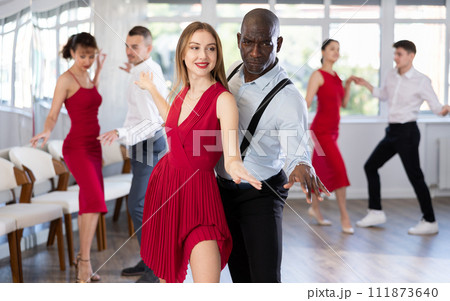Adult man and young woman dancing twist 111873640