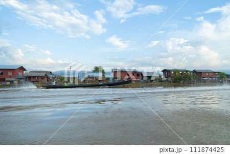 Inle Lake City, The Floating village urban city town houses, lake sea or river. Nature landscape fisheries and fishing tools, Myanmar. Aquaculture farming 111874425