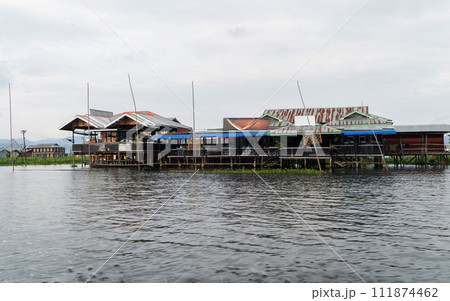 Inle Lake City, The Floating village urban city town houses, lake sea or river. Nature landscape fisheries and fishing tools, Myanmar. Aquaculture farming 111874462