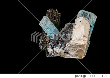 Macro stone mineral tourmaline aquamarine with a black background 111882199