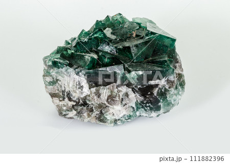 Macro mineral stone Fluorite white background Macro mineral stone Fluorite white background 111882396