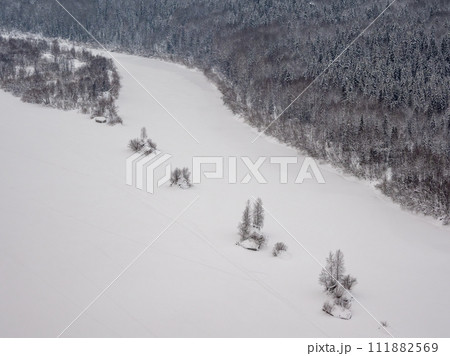 Vishera river, the bed of the taiga river under the snow. Vishera river, the bed of the taiga river under the snow. 111882569