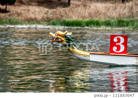 Prow of Traditional Chinese Dragon Boat on a river 111883047