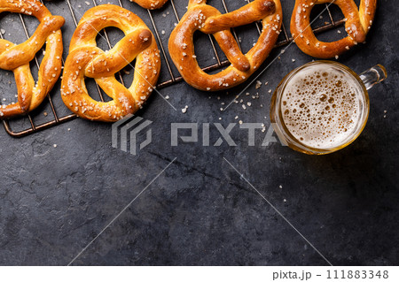 Freshly baked homemade pretzels and draft beer 111883348