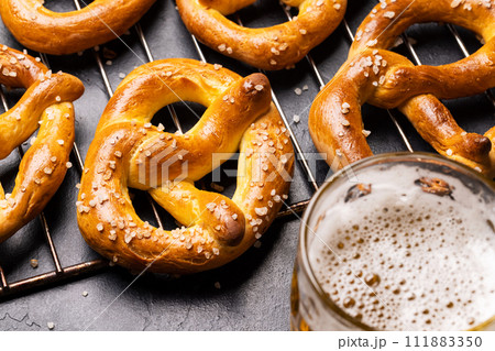 Freshly baked homemade pretzels and beer 111883350