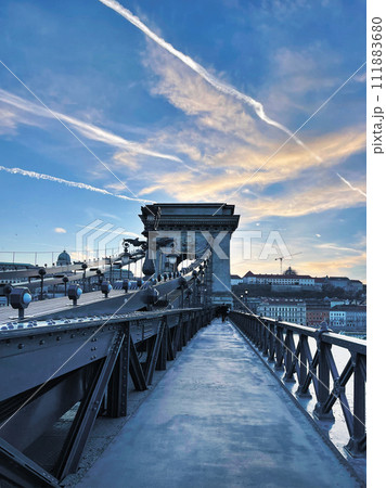 A fragment of the Szechenyi Chain Bridge over the Danube River in the early morning against a blue sky, 111883680