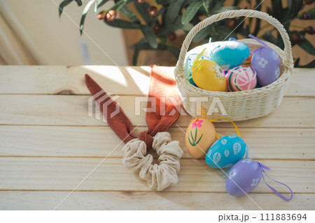 easter holiday concept with colorful egg and put in basket and put on wood table 111883694