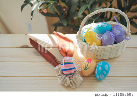 easter holiday concept with colorful egg and put in basket and put on wood table easter holiday concept with colorful egg and put in basket and put on wood table 111883695