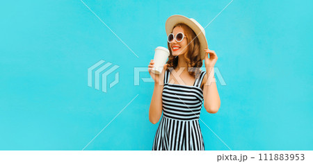 Portrait of happy smiling young woman drinking fresh juice or coffee in summer straw hat, dress Portrait of happy smiling young woman drinking fresh juice or coffee in summer straw hat, dress 111883953