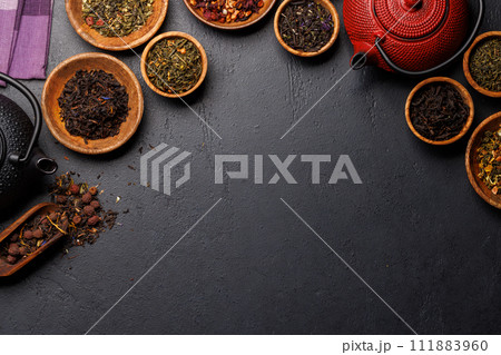 A collection of various teas nestled in wooden bowls A collection of various teas nestled in wooden bowls 111883960