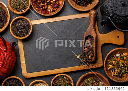 A collection of various teas nestled in wooden bowls A collection of various teas nestled in wooden bowls 111883962