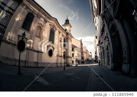 Scenic narrow cobbled street with historic buildings in an old town of Pilsen (Plzen). Czech Republic 111885940