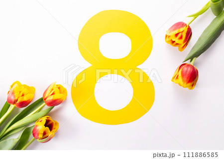International Women's Day greeting card. 8 March concept. Tulip and yellow number eight on white background 111886585