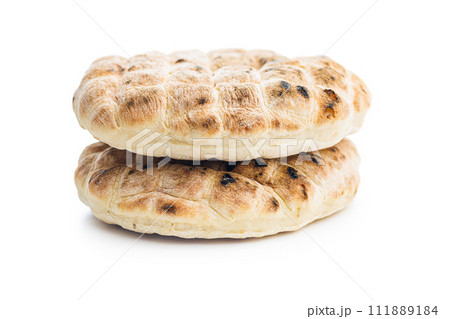 Arabic flat pita bread isolated on white background. 111889184