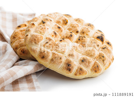 Arabic flat pita bread isolated on white background. 111889191