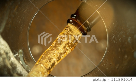 Macro Shot of Beer Pouring into Glass. Macro Shot of Beer Pouring into Glass. 111891014