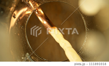 Macro Shot of Beer Pouring into Glass. 111891018