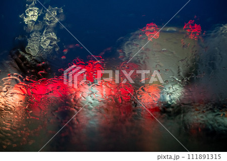 Abstract Rain-Distorted Lights on Car Windshield Abstract Rain-Distorted Lights on Car Windshield 111891315