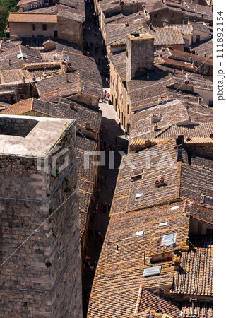 Wide panoramic view over downtown San Gimignano, Torre Ficarelli in the center, seen from Torre Grosso Wide panoramic view over downtown San Gimignano, Torre Ficarelli in the center, seen from Torre Grosso 111892154