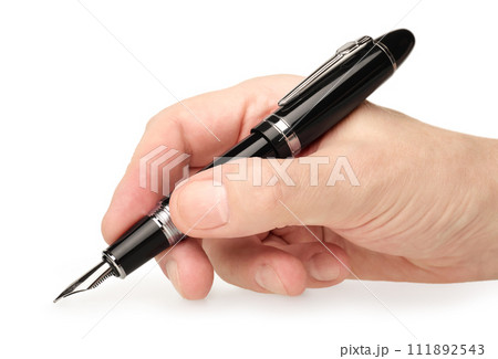 Hand holding classic black fountain pen 111892543