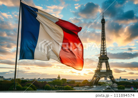 Evening Elegance: French Flag Waving Proudly Near the Eiffel Tower Evening Elegance: French Flag Waving Proudly Near the Eiffel Tower 111894574
