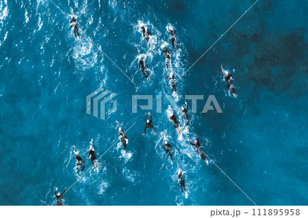 Triathlete swimmers during competition. Overhead view 111895958