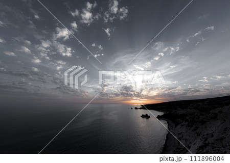 Last rays of sunset over calm sea 111896004