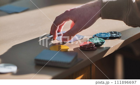 Young guys playing poker at a table. Young guys playing poker at a table. 111896697