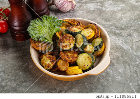 Roasted young zucchini in the plate Roasted young zucchini in the plate 111896811