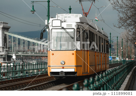 Vintage orange tram somewhere in Budapest, Hungary Vintage orange tram somewhere in Budapest, Hungary 111899081