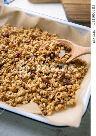 homemade granola in iron pan 111900283
