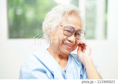 Asian senior woman wearing eyeglasses or vision glasses at home care service. Asian senior woman wearing eyeglasses or vision glasses at home care service. 111900821