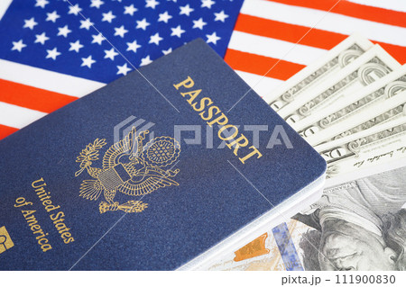 US passport with dollar money on USA flag, American citizen in United States of America. US passport with dollar money on USA flag, American citizen in United States of America. 111900830