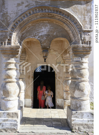 Mother and daughter enter Church of the Savior on Spilled Blood in monastery in Rostov the Great Mother and daughter enter Church of the Savior on Spilled Blood in monastery in Rostov the Great 111902837