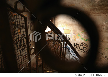 Wrought iron railings of staircase in old shabby building 111906607
