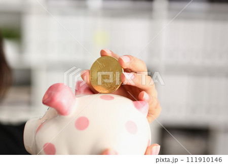 A young smiling chinese woman holding 111910146