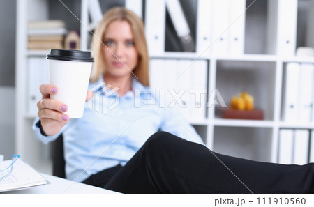 Smiling business woman drinking coffee Smiling business woman drinking coffee 111910560