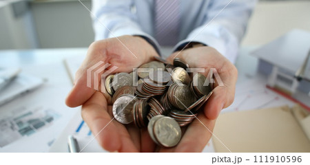 Hand businessman putting pin money Hand businessman putting pin money 111910596