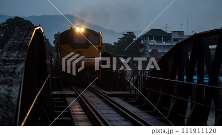 Antique steam train across river Kwai bridge, Kanchanaburi Antique steam train across river Kwai bridge, Kanchanaburi 111911120