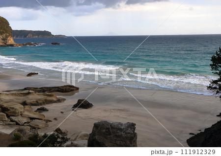 Tatadohama beach at Shimoda on the Izu penninsula of Shizuoka Japan, famous for beautiful white sand, surfing, and nearby onsen hot spring mineral baths 111912329
