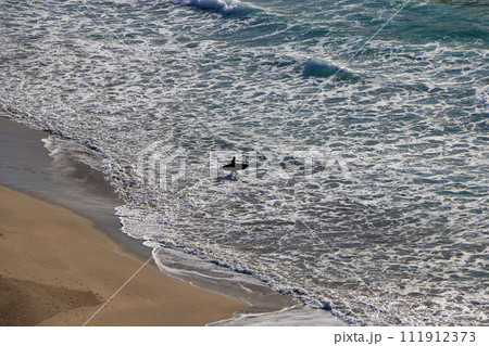 Tatadohama beach at Shimoda on the Izu penninsula of Shizuoka Japan, famous for beautiful white sand, surfing, and nearby onsen hot spring mineral baths 111912373