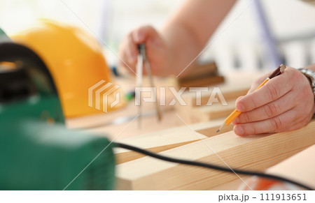 Arms of worker making structure plan 111913651