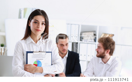 Beautiful smiling cheerful girl at workplace Beautiful smiling cheerful girl at workplace 111913741