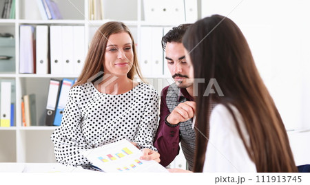 Group of people sit in office deliberate problem 111913745