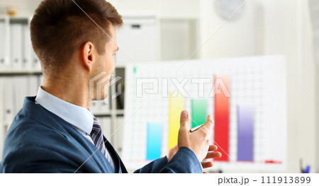 Man in suit point with arm in stats graph Man in suit point with arm in stats graph 111913899