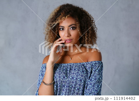 Beautiful black woman portrait. Worth a gray 111914402