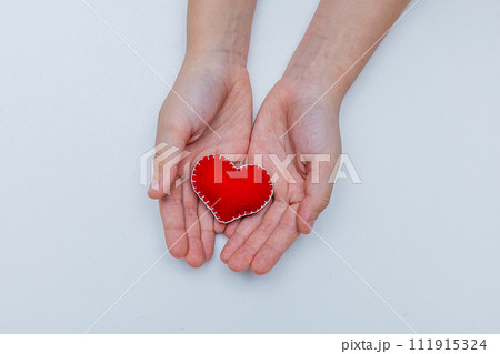 Frame from red felt hearts on white background. St. Valentine's Day concept. Top view, copy space Frame from red felt hearts on white background. St. Valentine's Day concept. Top view, copy space 111915324