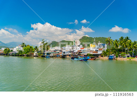 Houses on the river bank. 111916563